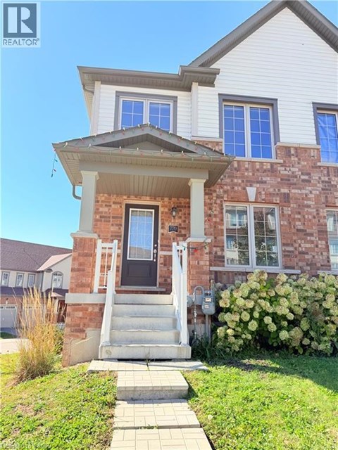 A house with a front porch and a small front yard.