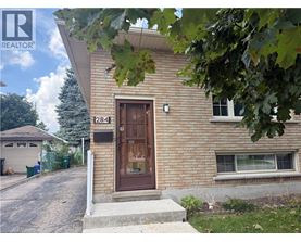 A house with a brown door and a sign that says 284 on it.