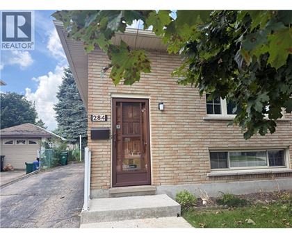 A house with a brown door and a sign that says 284 on it.