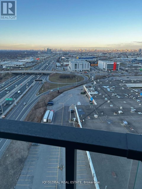 A view of a busy highway interchange with multiple lanes and vehicles.