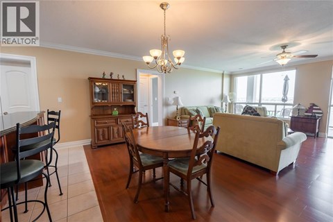 A dining room with a table set for six.