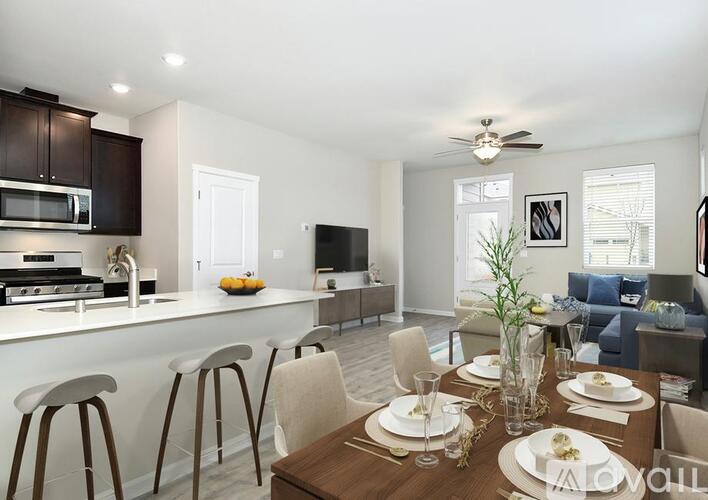 A modern kitchen with a dining table set for four.