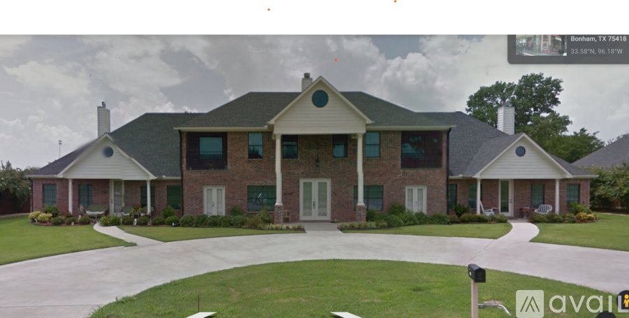 A house with a green lawn and a sign that says "avai".