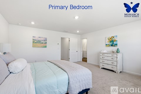 A bedroom with a bed, dresser and painting on the wall.