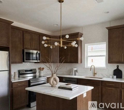 A kitchen with brown cabinets and a white countertop.