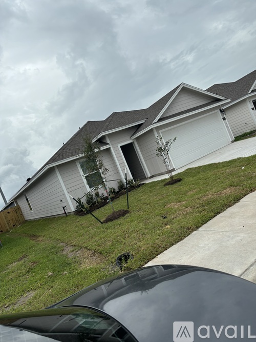 A house with a car in front of it.