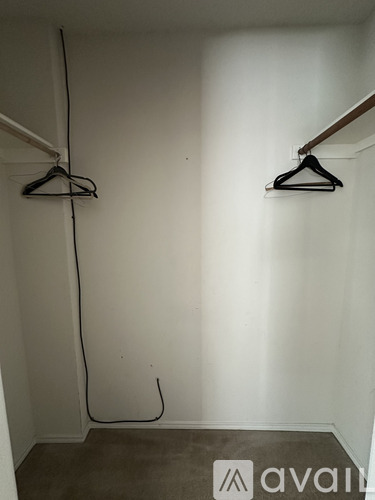 A room with two hangers on the wall.