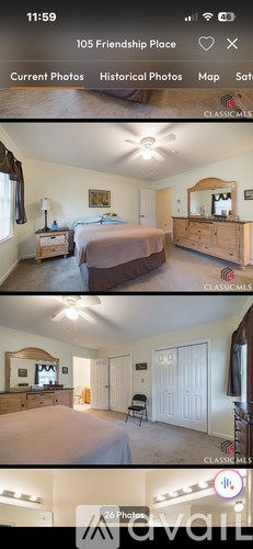 A bedroom with a bed, dresser, and mirror.
