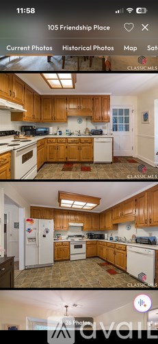 A kitchen with wooden cabinets and white appliances.