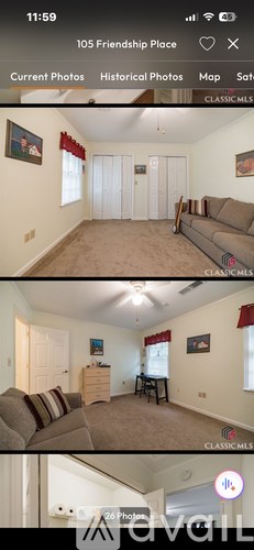 A living room with a couch, a chair, and a small table.