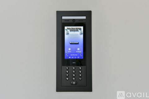 A black device with a screen displaying a welcome message.