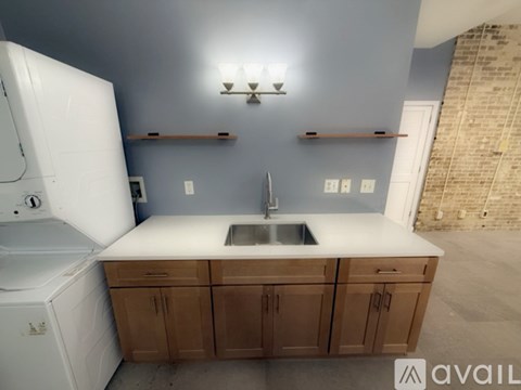 A kitchen with a white dishwasher and a white refrigerator.