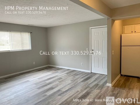 A room with a door and a window, with text overlay for HPM Property Management.