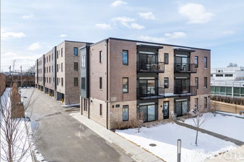 Apartment complex with a mix of brick and panel buildings.