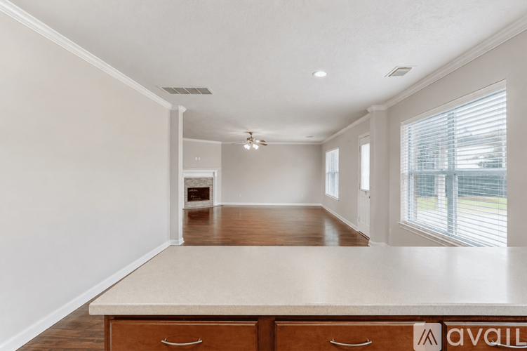 A spacious room with a long counter and drawers.