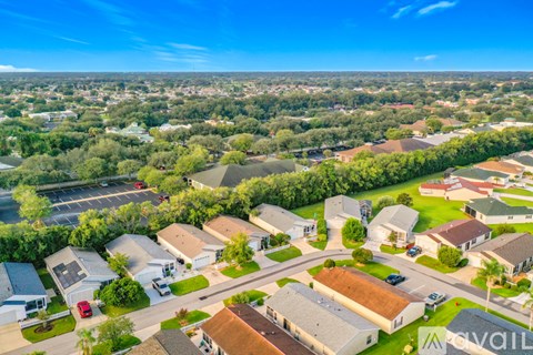 A bird's eye view of a residential area with houses and roads.