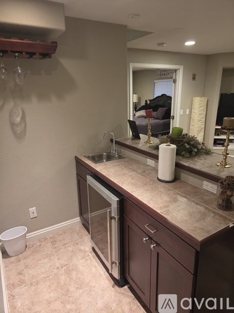 A kitchen with brown cabinets and a white countertop.