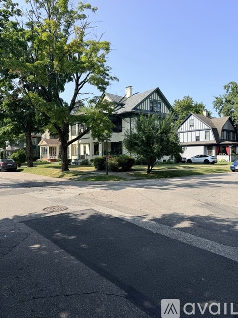 A house with a tree in front of it.