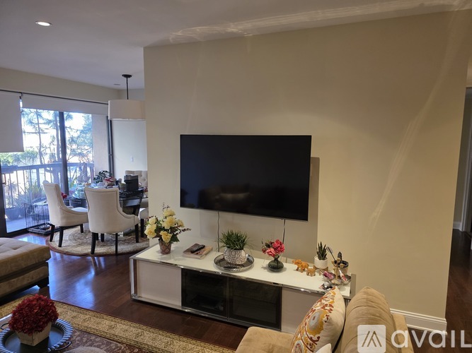 A living room with a television and a coffee table.