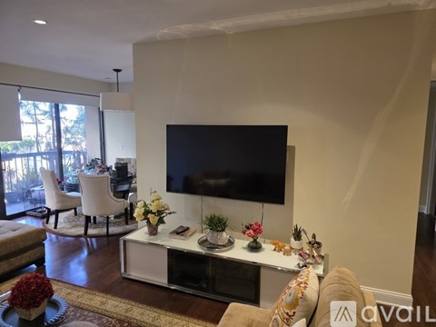 A living room with a television and a coffee table.