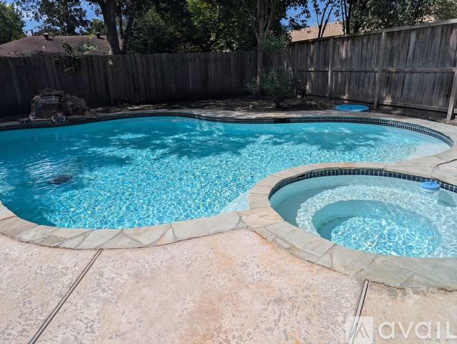 A pool with a blue tinted water.