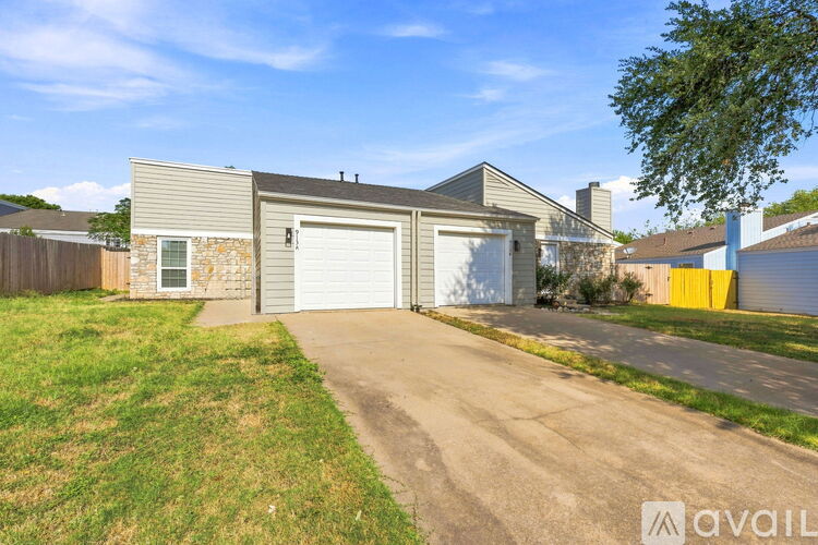 A house with a garage is available for sale.
