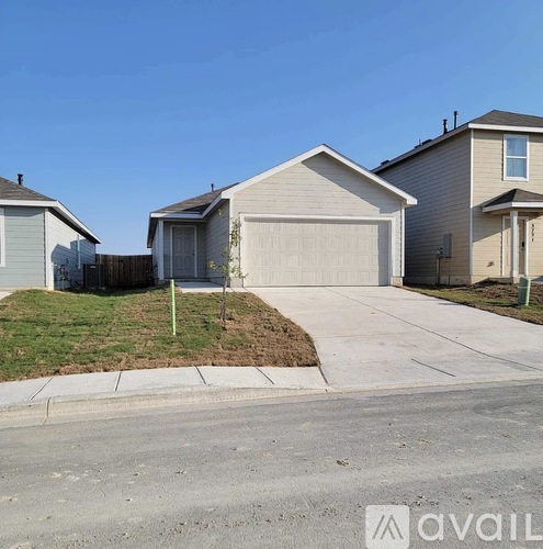 A house with a garage is available for sale.