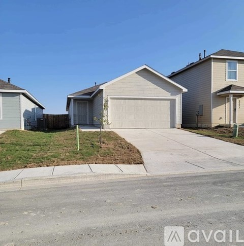 A house with a garage is available for sale.