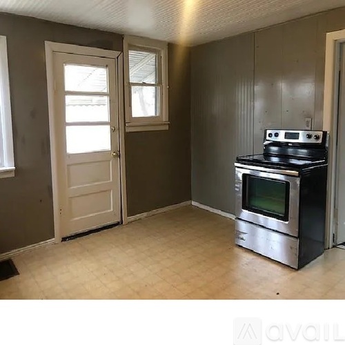 A kitchen with a stove and oven in it.