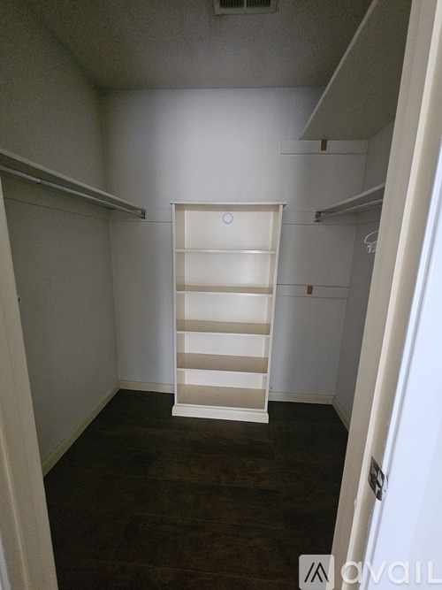 A white ladder is in the middle of a room.
