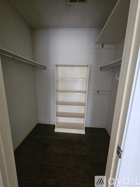 A white ladder is in the middle of a room.