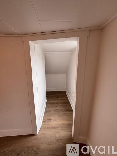 A hallway with a light at the end.