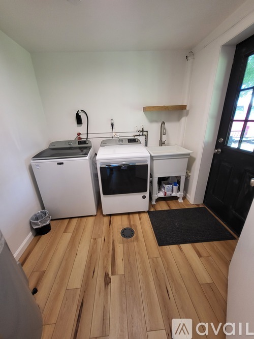 A kitchen with a white fridge and a white dishwasher.