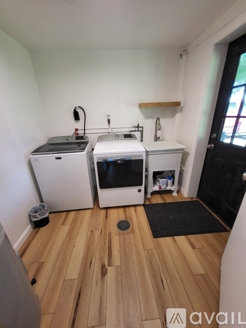 A kitchen with a white fridge and a white dishwasher.