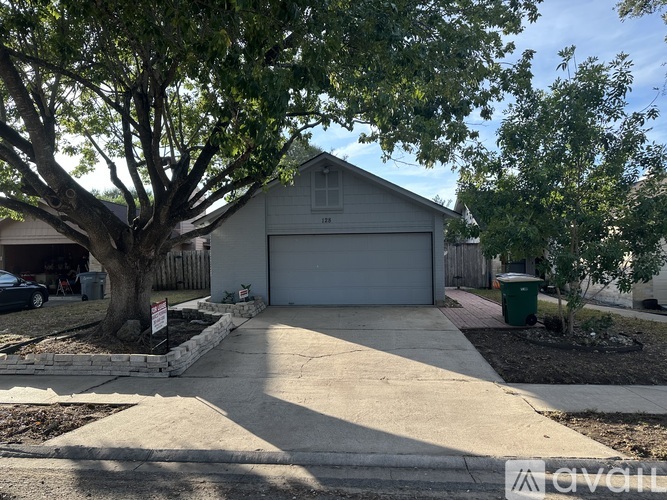 A house with a tree in front of it.