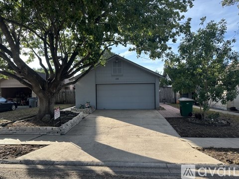 A house with a tree in front of it.