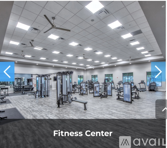 A fitness center with a variety of equipment.