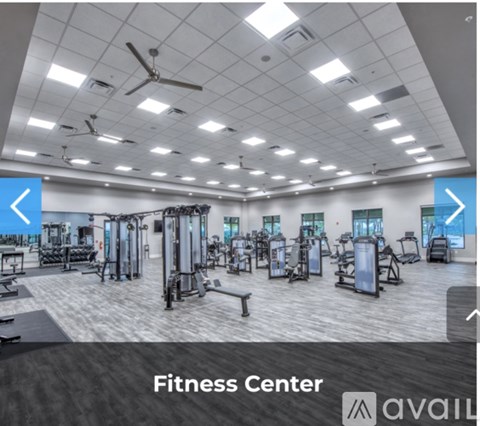 A fitness center with a variety of equipment.