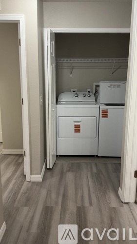 A small kitchen with a dishwasher and a white oven.