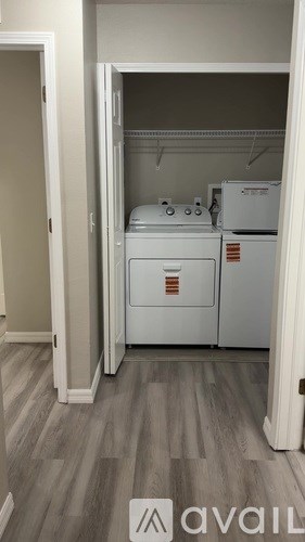 A small kitchen with a dishwasher and a white oven.
