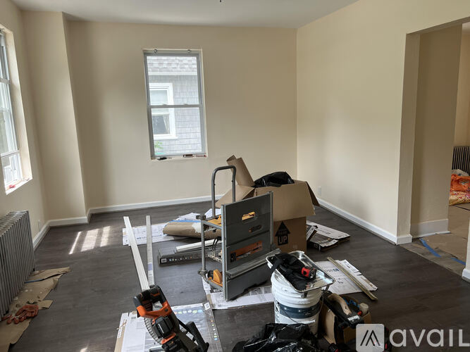 A room with a lot of construction materials and tools scattered around.