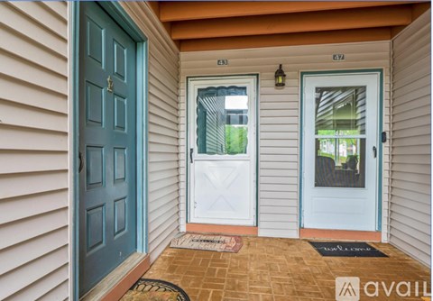 A blue door is on the left and a white door is on the right.