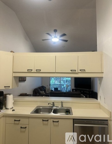A kitchen with a sink and cabinets.