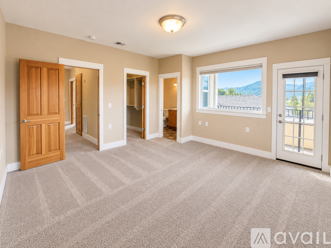 A house with a red brick exterior and a white trim is for sale.
