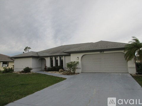 A house with a driveway and a garage door.