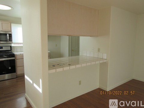 A kitchen with a stove top oven and microwave.