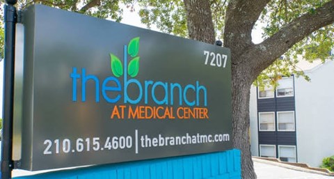 A sign for The Branch Medical Center with a phone number and website.