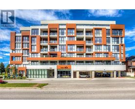 A multi-story building with a realtor logo on the top left corner.