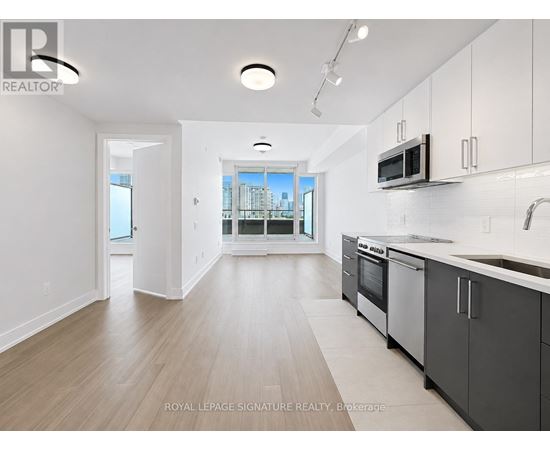 A kitchen with a sink, microwave, and oven.