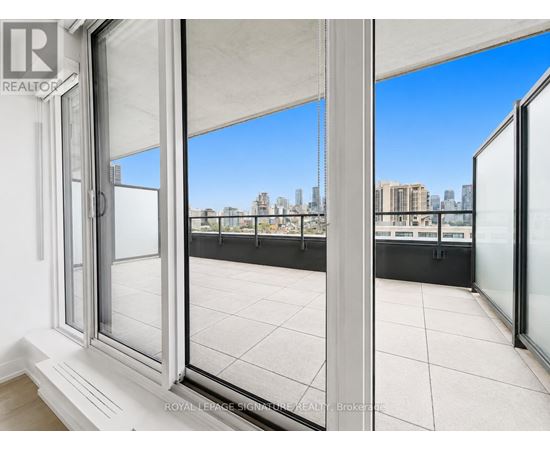 A white window with a view of a city skyline.